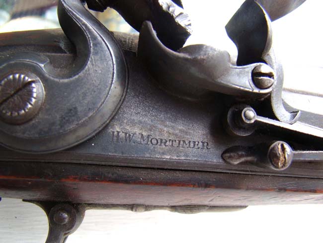 A late 18th or early 19th century steel barreled FLINTLOCK BLUNDERBUSS by H.W. Mortimer, London, Gun Maker to His Majesty, King George III.